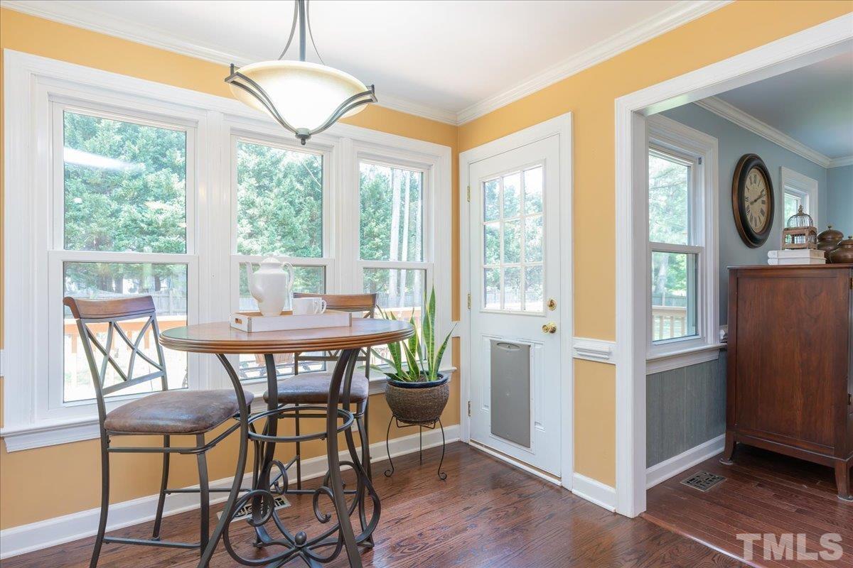 908 Broadhaven Drive Raleigh, NC 27603 - Photo 12 of 33 a view of a dining room with furniture window and outside view