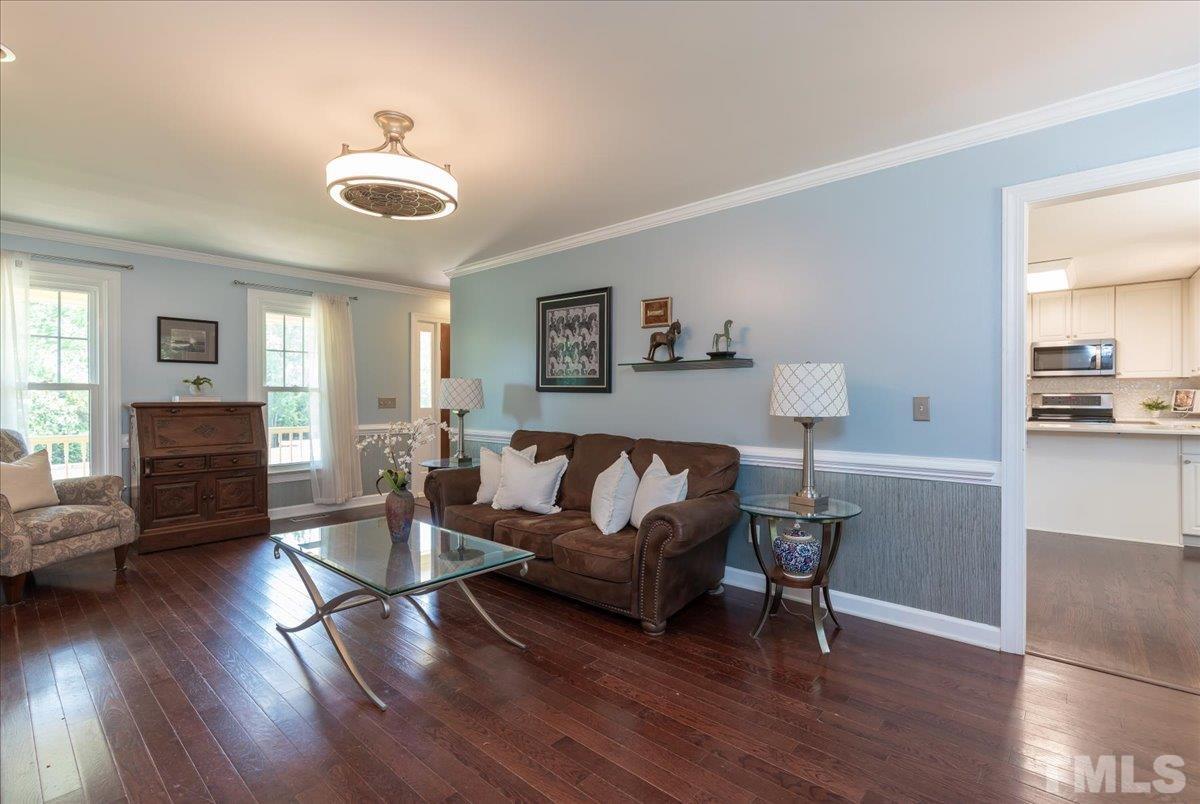 908 Broadhaven Drive Raleigh, NC 27603 - Photo 13 of 33 a living room with furniture and a wooden floor
