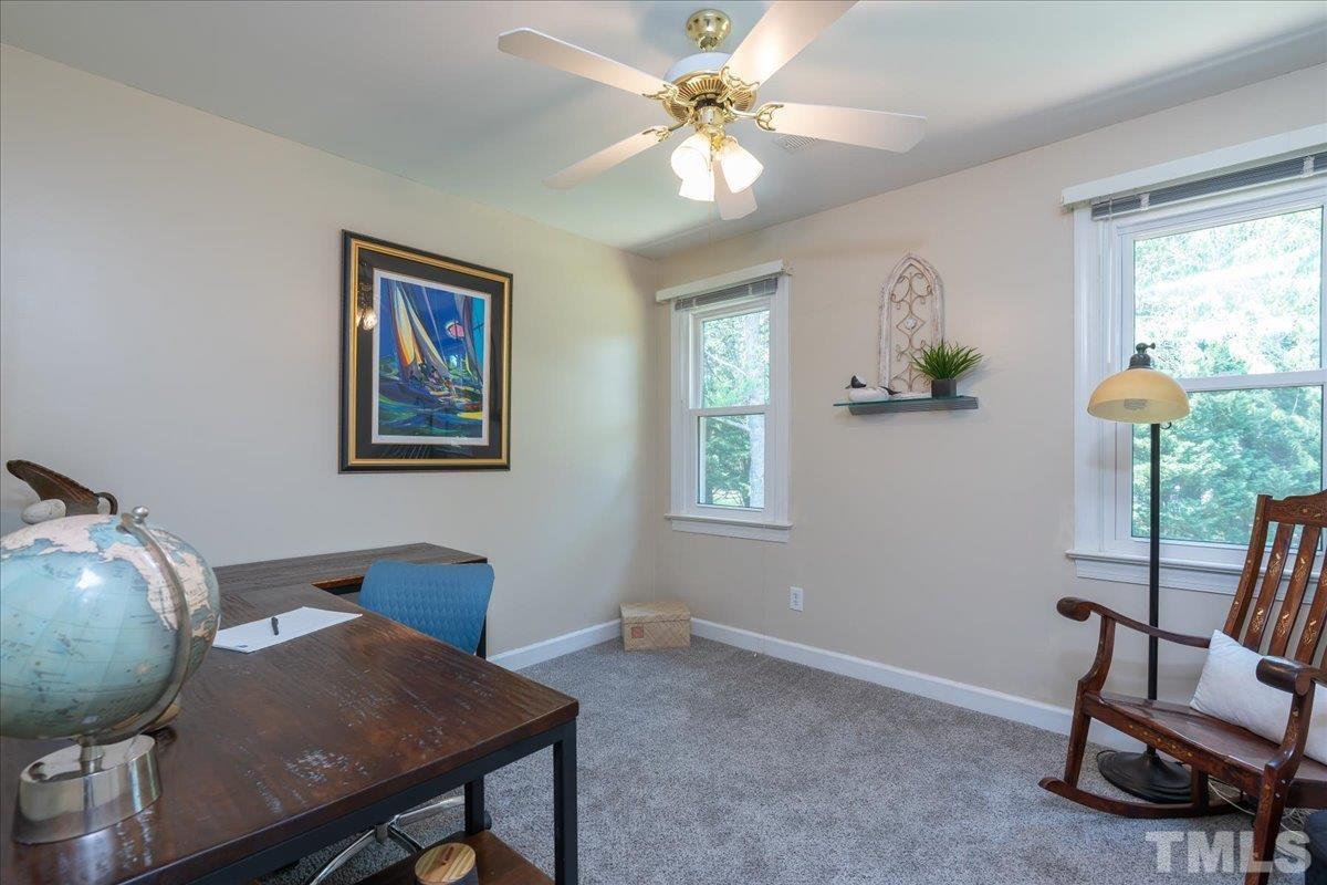 908 Broadhaven Drive Raleigh, NC 27603 - Photo 17 of 33 a view of a workspace with furniture and a window