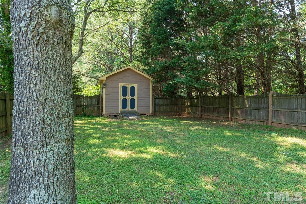 908 Broadhaven Drive Raleigh, NC 27603 - Photo 27 of 33 a view of a house with a backyard