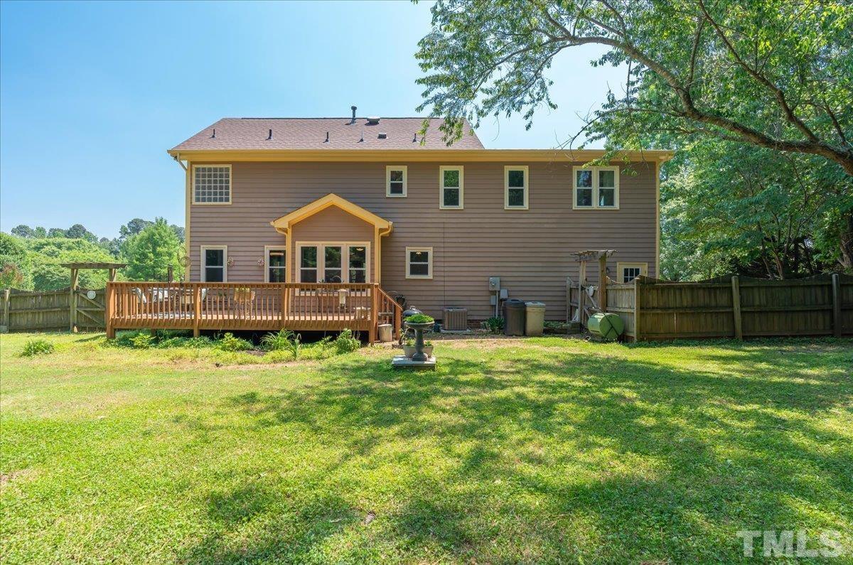 908 Broadhaven Drive Raleigh, NC 27603 - Photo 29 of 33 a front view of house with a garden