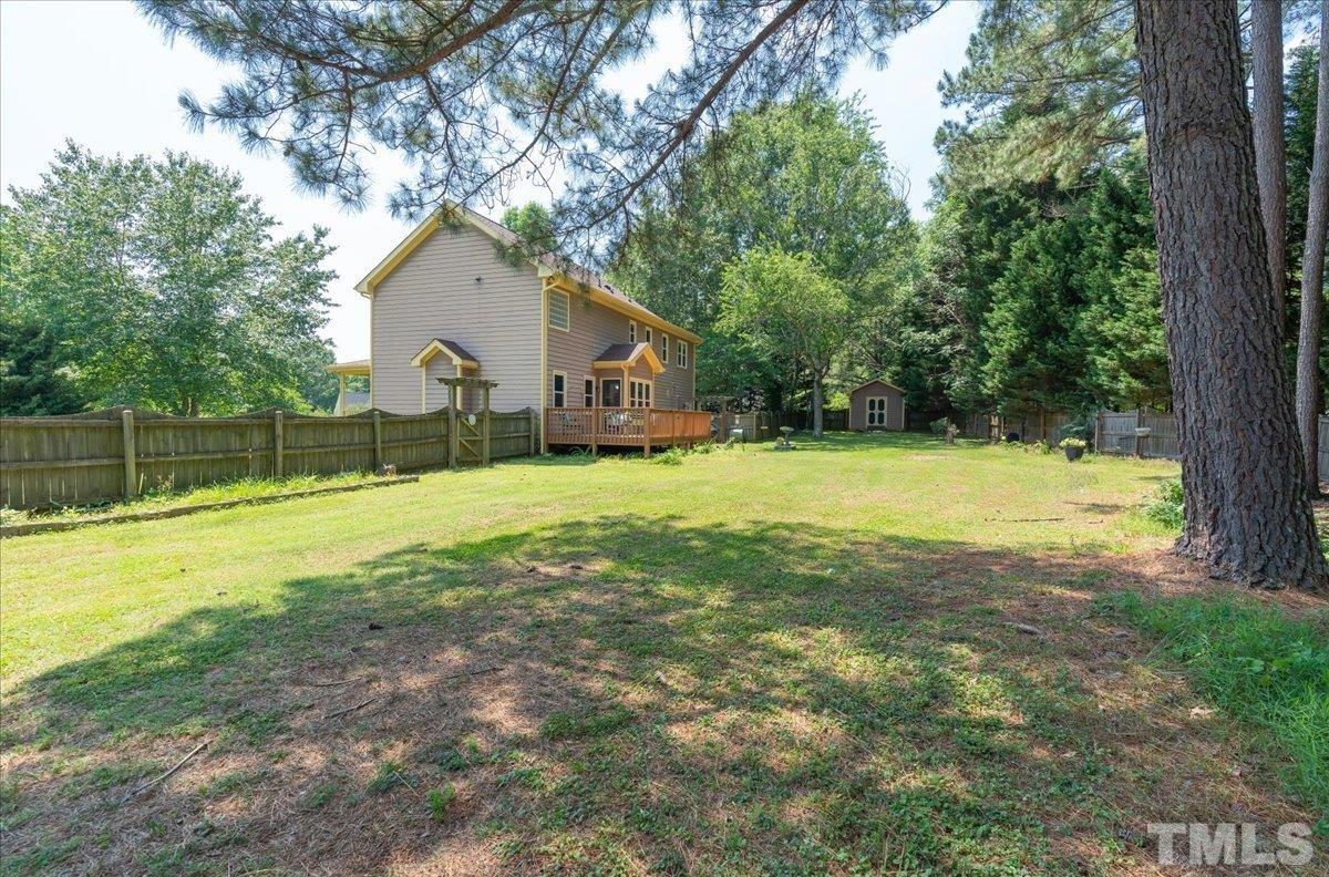 908 Broadhaven Drive Raleigh, NC 27603 - Photo 31 of 33 a view of a house with a yard and large trees