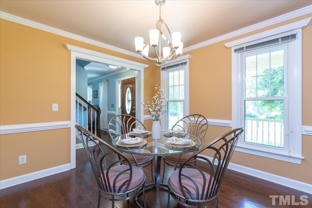 908 Broadhaven Drive Raleigh, NC 27603 - Photo 6 of 33 a view of a dining room with furniture window and wooden floor