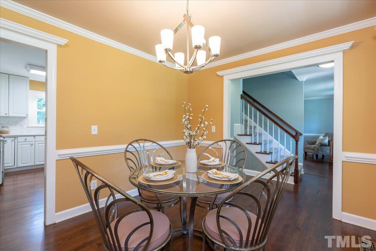 908 Broadhaven Drive Raleigh, NC 27603 - Photo 7 of 33 a view of a dining room with furniture and chandelier