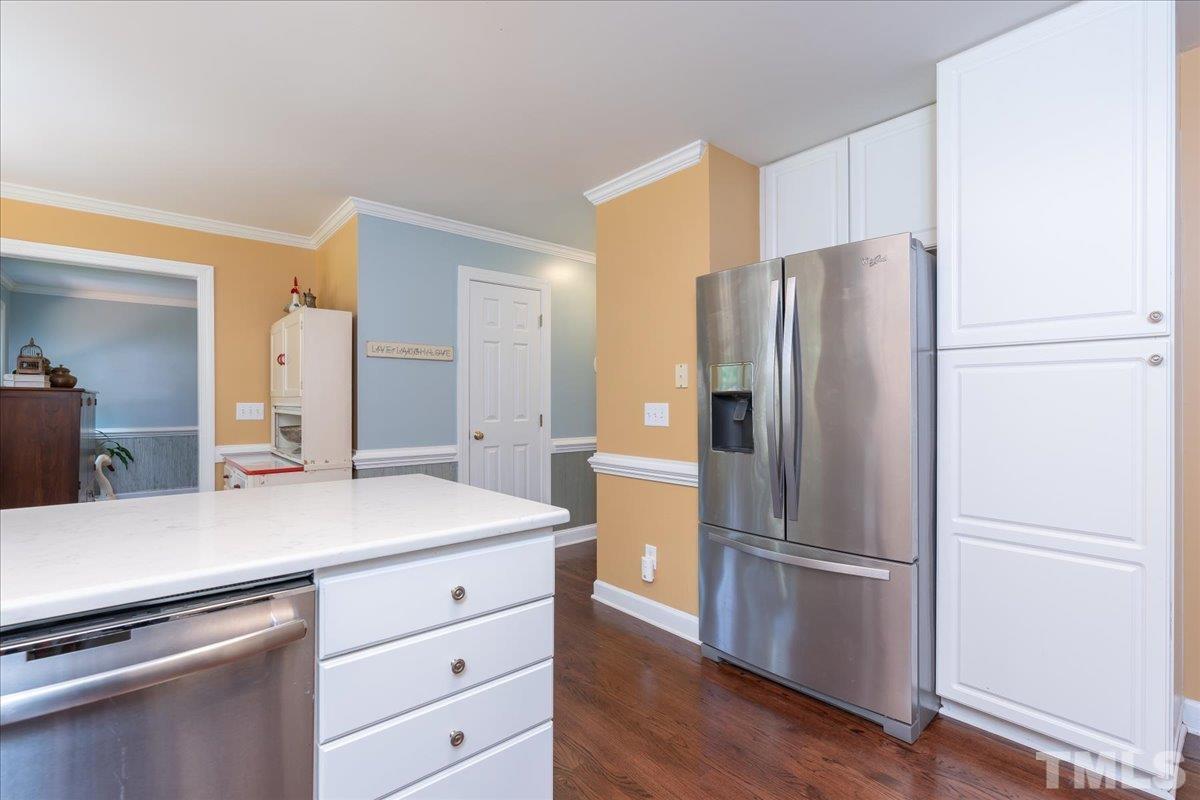 908 Broadhaven Drive Raleigh, NC 27603 - Photo 9 of 33 a kitchen with appliances and a refrigerator
