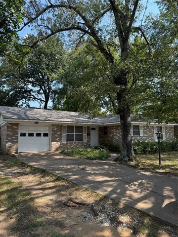 a house view with a backyard space