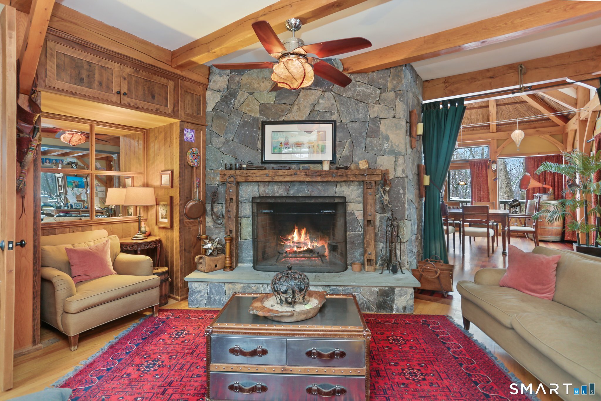 142 Seventy Acre Road Redding, CT 06896 - Photo 8 of 40 a living room with furniture and a fireplace