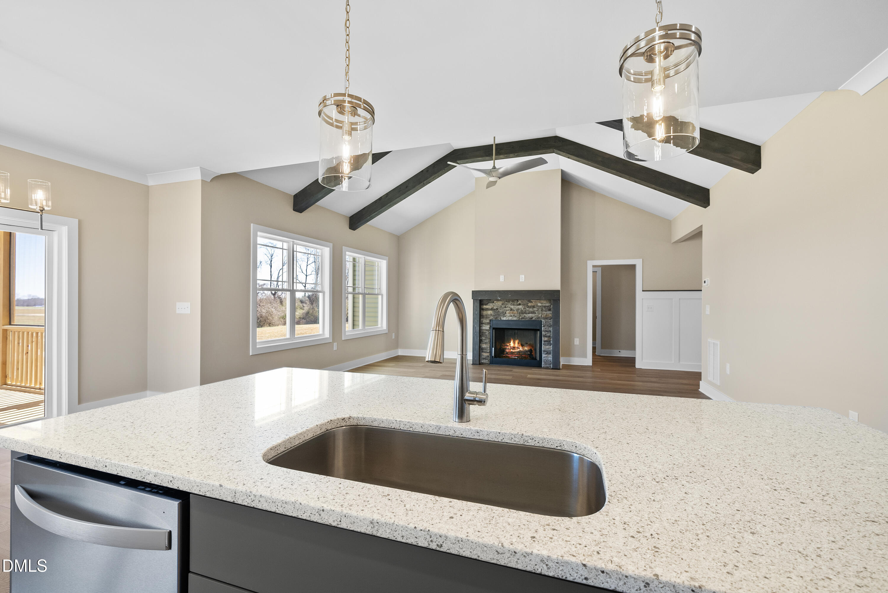 5549 River Buck Rd Spring Spring Hope, NC 27882 - Photo 12 of 35 a kitchen with a sink a chandelier and fireplace