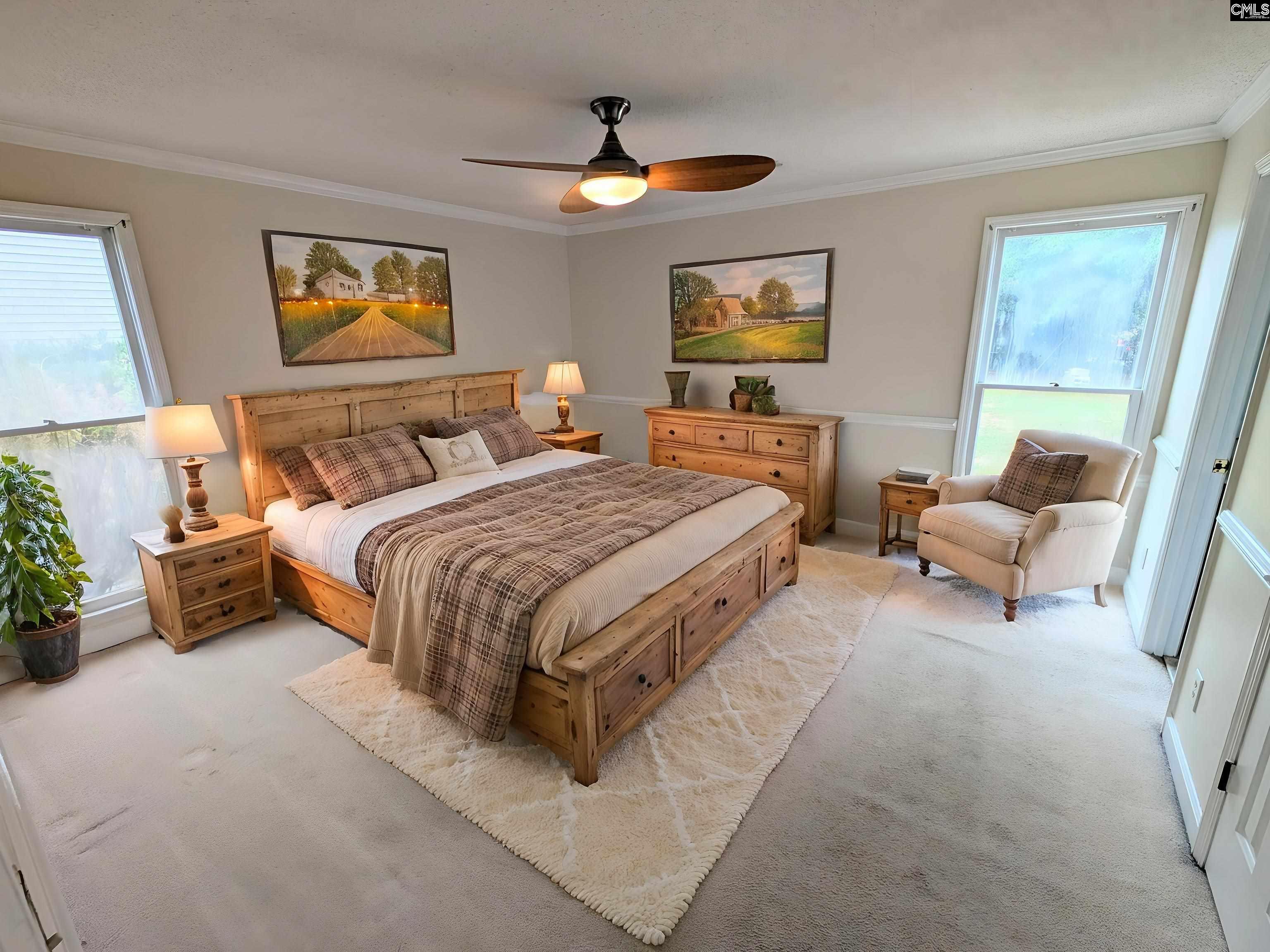 100 Welsh Court Lexington, SC 29073 - Photo 11 of 27 a bedroom with a bed and a chandelier