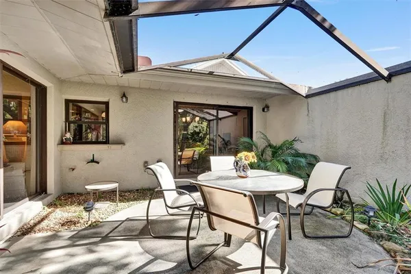 a outdoor space with a couch and chairs