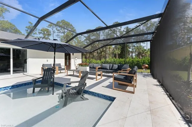 a view of a patio with table and chairs potted plants with wooden floor