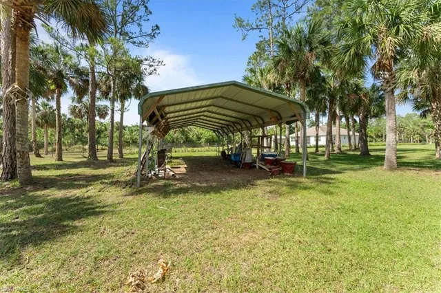 a view of outdoor space with garden and trees