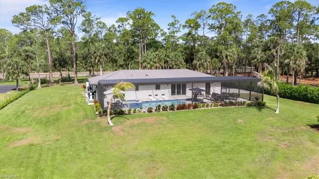a view of a house with a yard porch and sitting area
