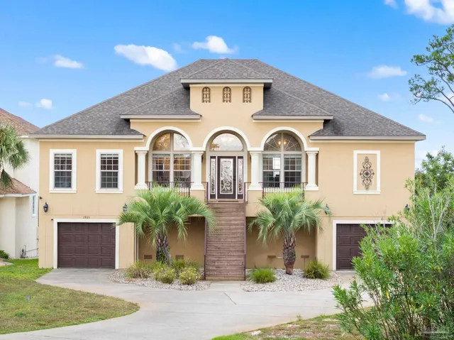 a front view of a house with garden