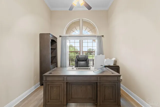 a spacious bedroom with a bed and a chandelier