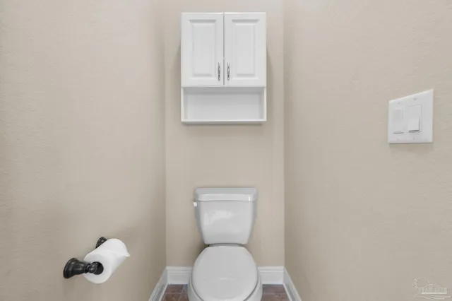 a bathroom with a tub a window and a shower