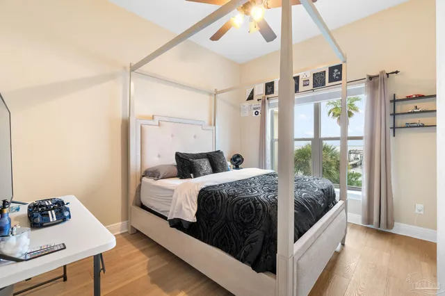 a bedroom with a bed a window and a walk in closet