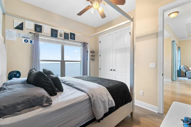 a bathroom with a granite countertop sink a toilet and a mirror