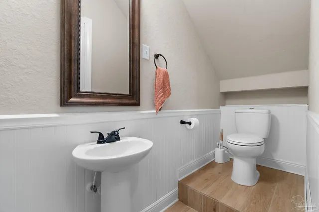 a spacious bedroom with a bed and large windows