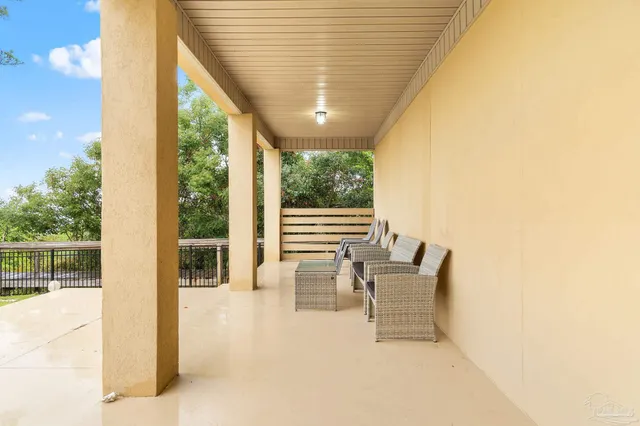 a view of a house with a backyard and a patio