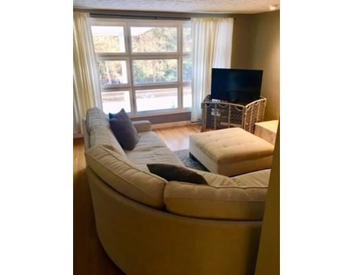 113 Concord Road Chelmsford, MA 01824 - Photo 3 of 14 a living room with furniture and a flat screen tv