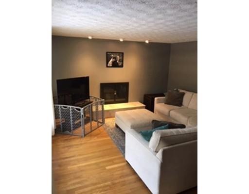 113 Concord Road Chelmsford, MA 01824 - Photo 4 of 14 a living room with furniture and a flat screen tv