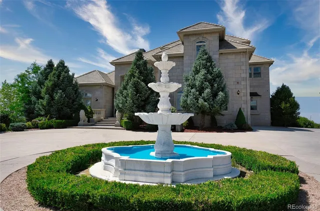 a dining room with furniture and a floor to ceiling window