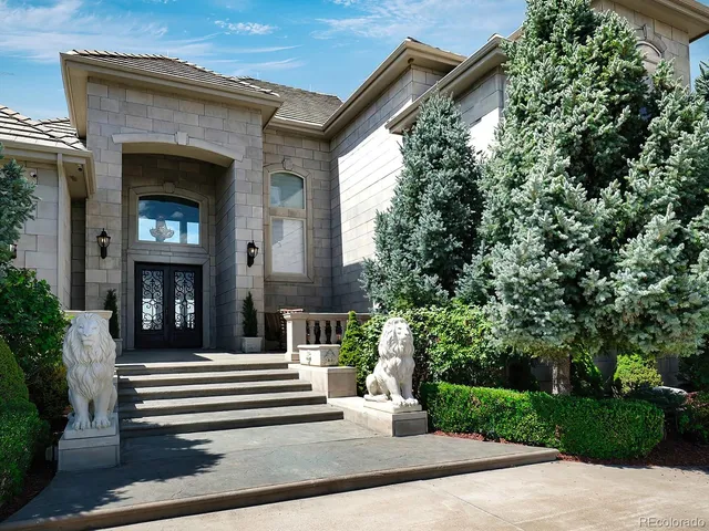 a kitchen with kitchen island granite countertop a stove and a sink with granite countertops