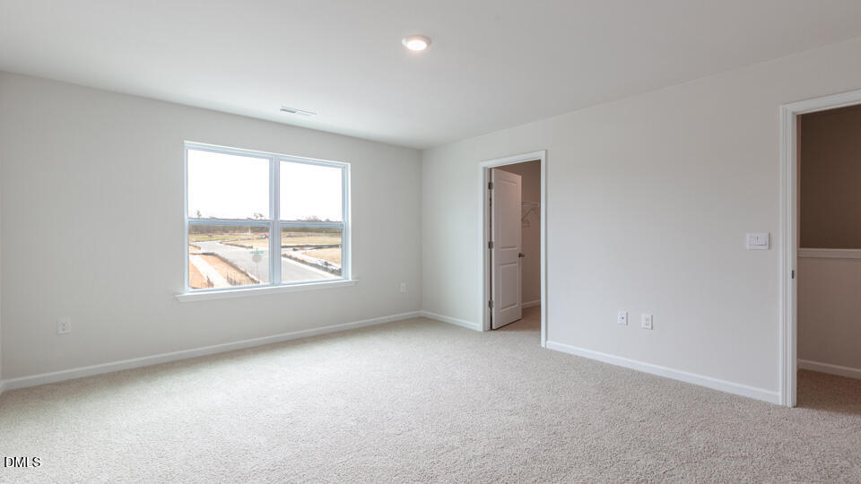 910 Sculptor Street Wendell, NC 27591 - Photo 16 of 44 an empty room with a window