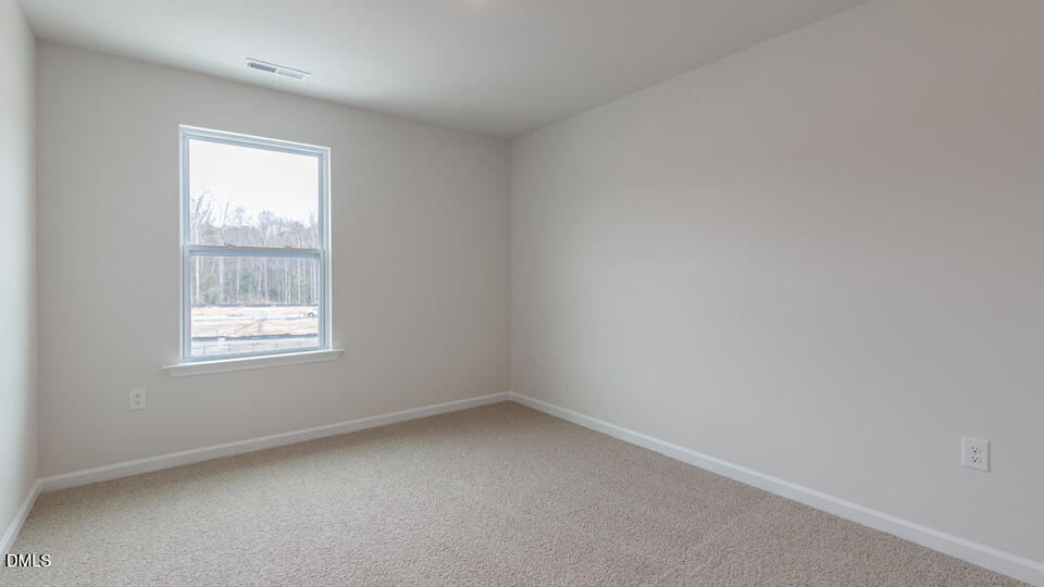 910 Sculptor Street Wendell, NC 27591 - Photo 23 of 44 an empty room with a window