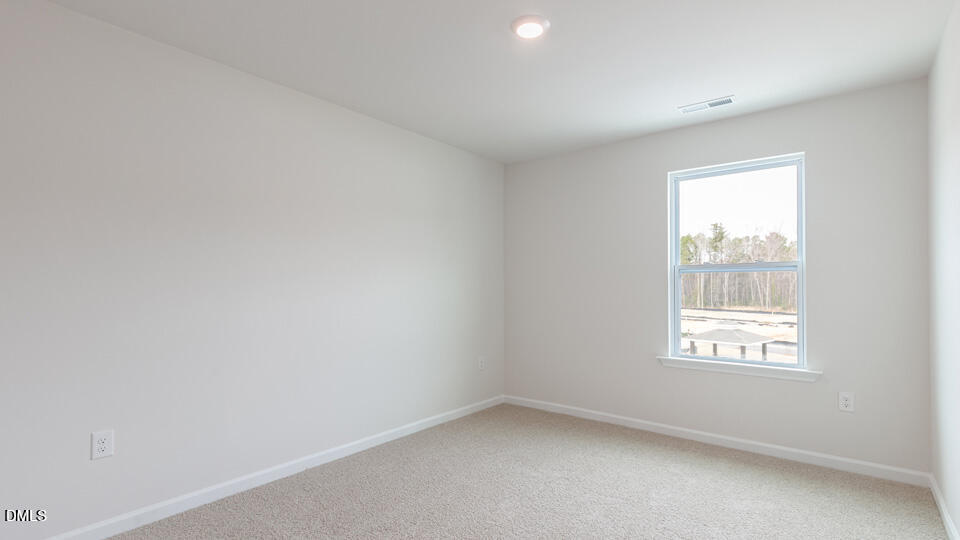 910 Sculptor Street Wendell, NC 27591 - Photo 25 of 44 an empty room with a window