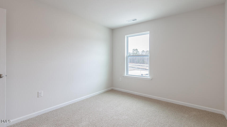 910 Sculptor Street Wendell, NC 27591 - Photo 26 of 44 an empty room with a window