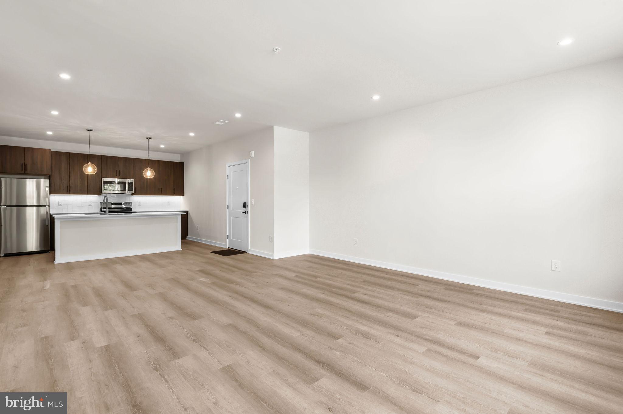 26 South York Road, Unit 402 Hatboro, PA 19040 - Photo 46 of 52 a view of a kitchen with a sink and a refrigerator