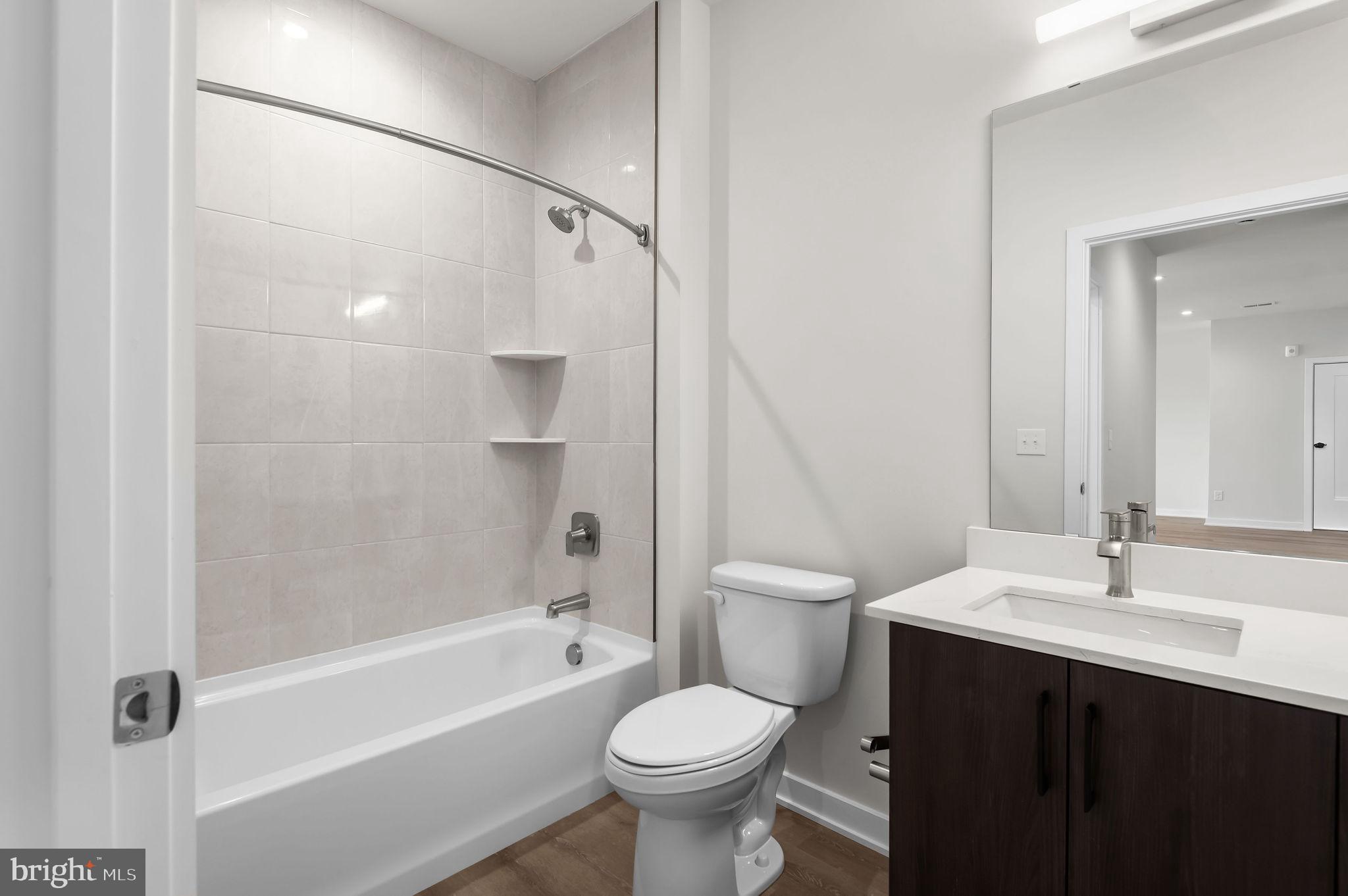 26 South York Road, Unit 402 Hatboro, PA 19040 - Photo 50 of 52 a bathroom with a sink toilet and shower