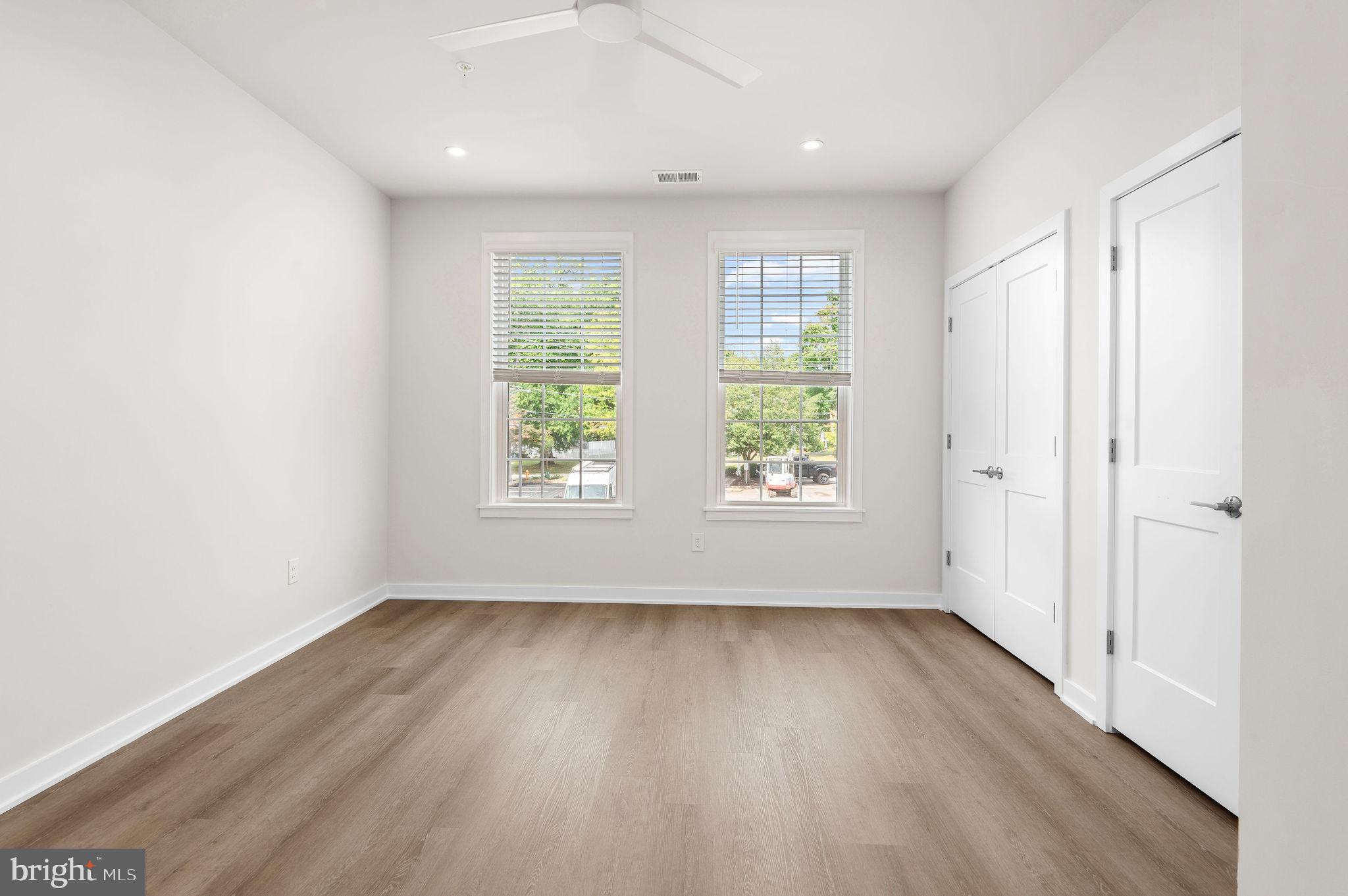 26 South York Road, Unit 402 Hatboro, PA 19040 - Photo 51 of 52 an empty room with wooden floor and window