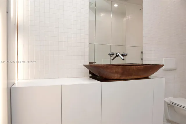 a bathroom with a sink and mirror