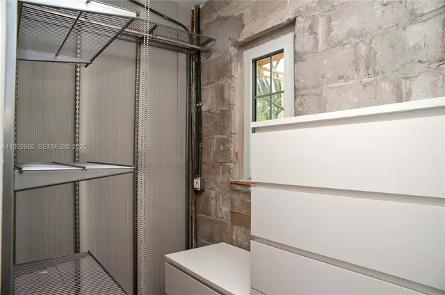 a bathroom with a shower and a sink