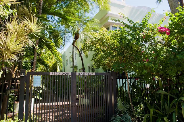 a view of street along with deck and garden