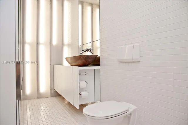 a bathroom with a toilet and a sink