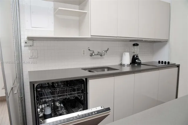 a kitchen with a stove and cabinets