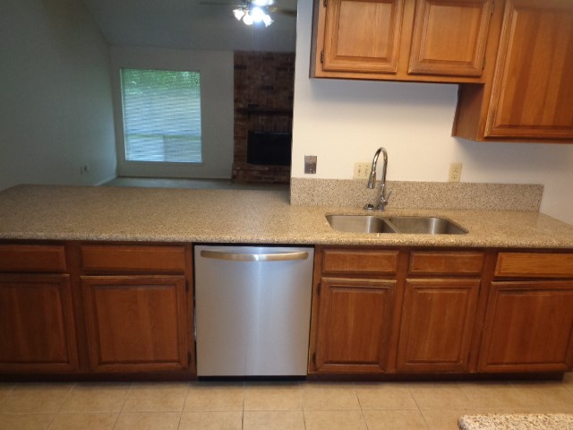 9530 Magnolia Ridge Drive Houston, TX 77070 - Photo 19 of 20 a kitchen with a sink and cabinets