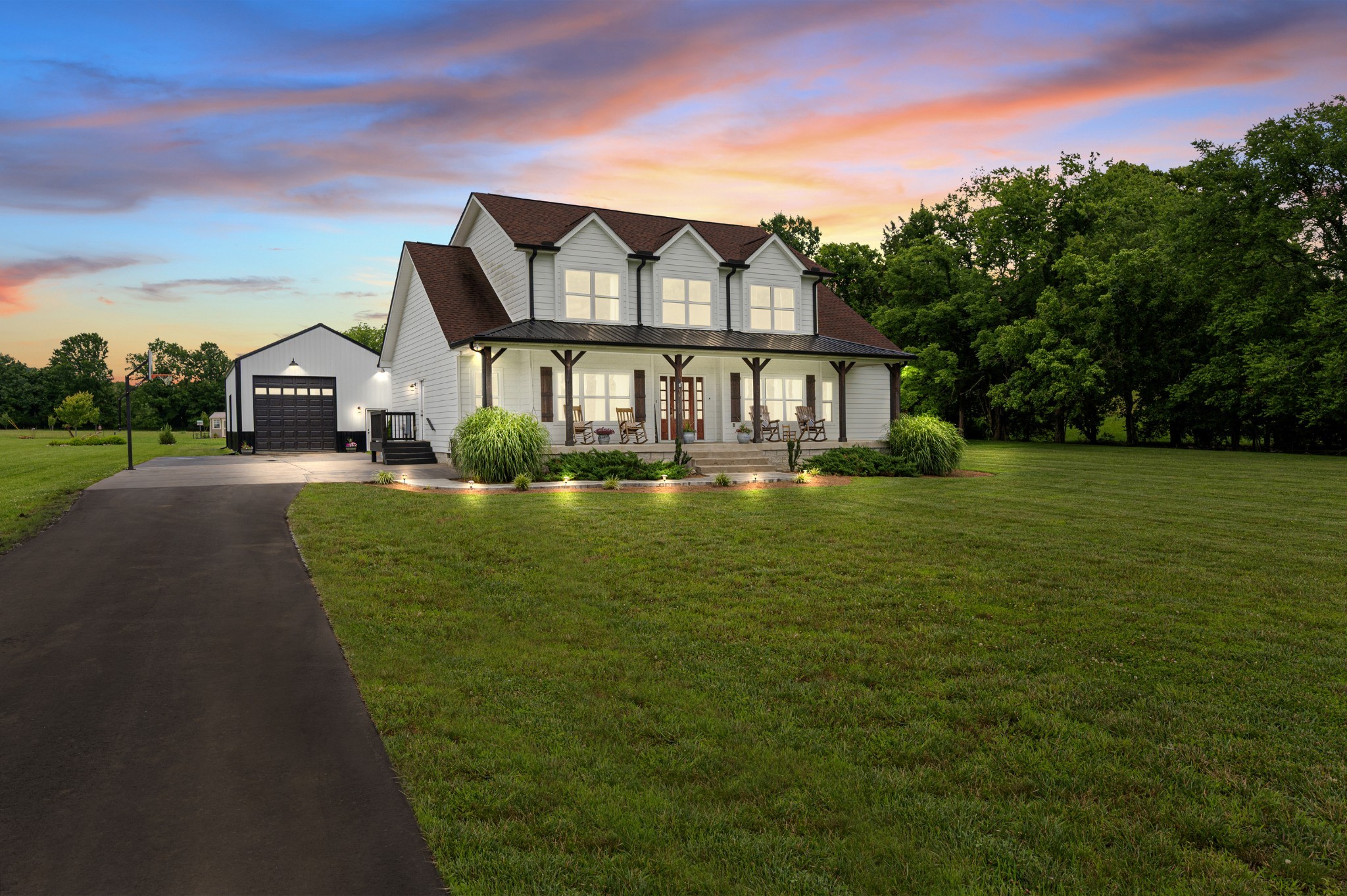 1675 Walnut Hill Road Lebanon, TN 37090 - Photo 1 of 54 a front view of a house with a garden and lake view