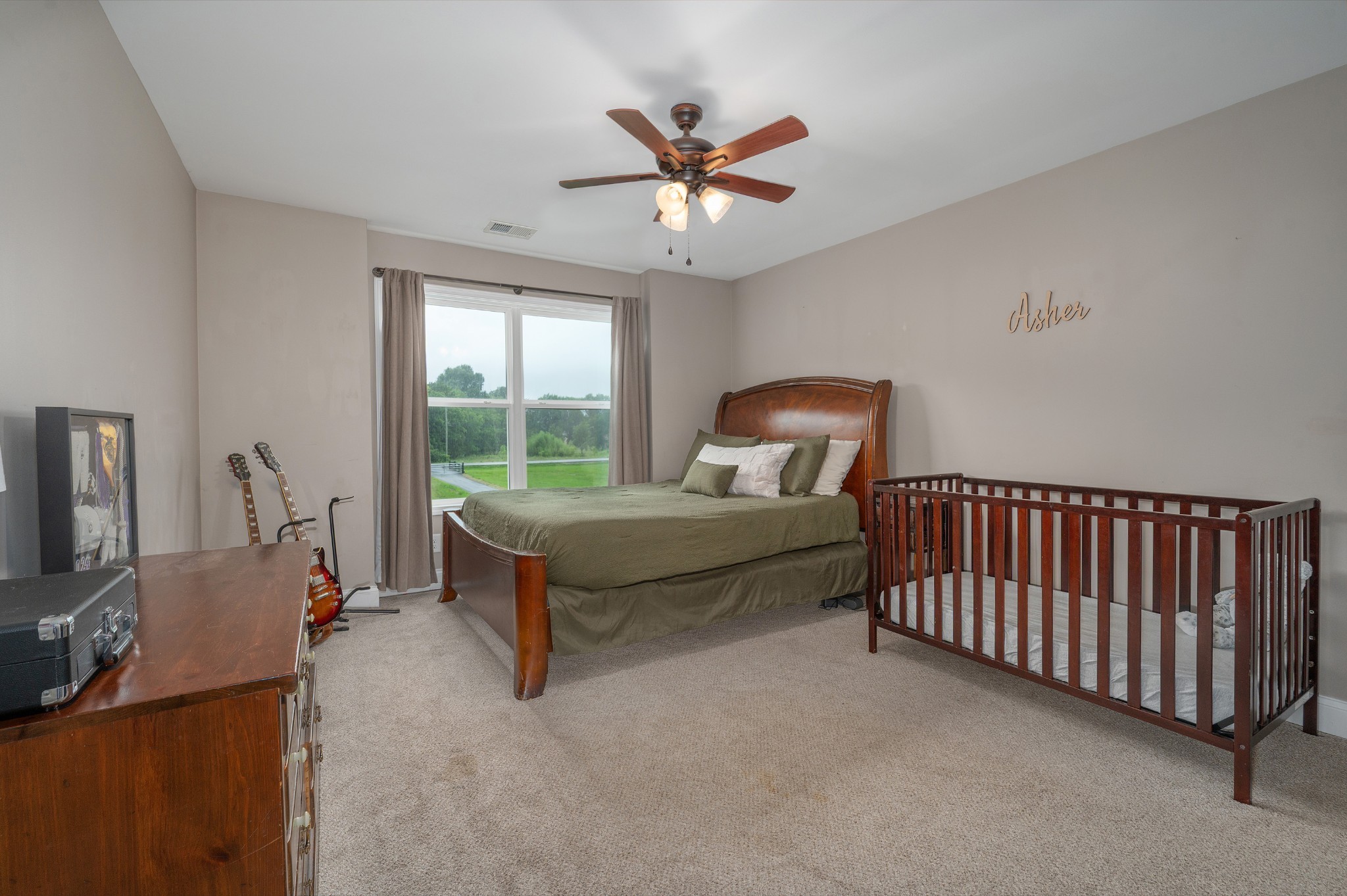 1675 Walnut Hill Road Lebanon, TN 37090 - Photo 29 of 54 a bedroom with a bed and a flat screen tv