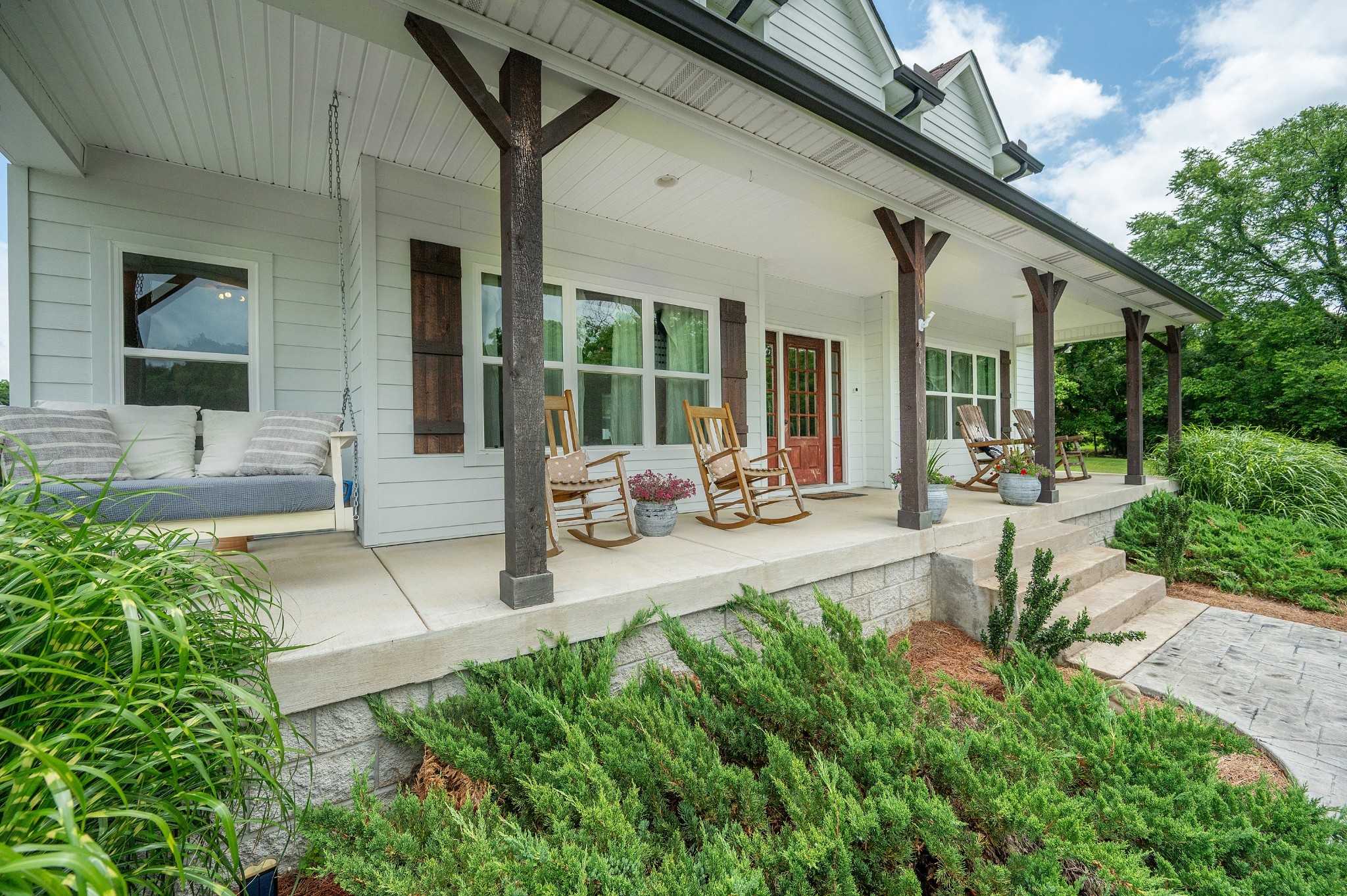 1675 Walnut Hill Road Lebanon, TN 37090 - Photo 3 of 54 a view of a patio with couches table and chairs and potted plants