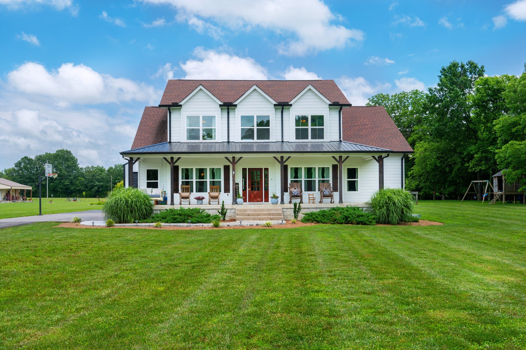 1675 Walnut Hill Road Lebanon, TN 37090 - Photo 40 of 54 a front view of a house with a garden and porch