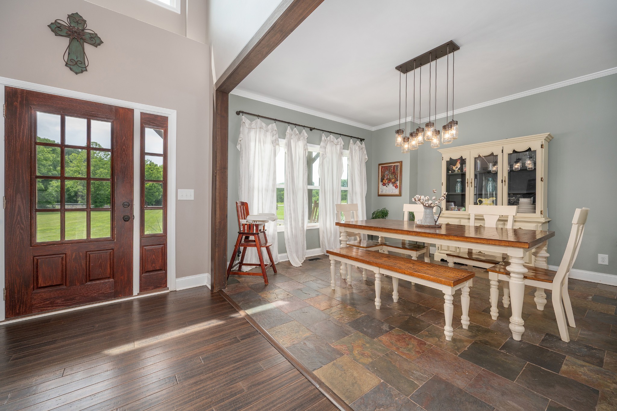 1675 Walnut Hill Road Lebanon, TN 37090 - Photo 9 of 54 a large dining hall with stainless steel appliances granite countertop a stove top oven a dining table and chairs with wooden floor