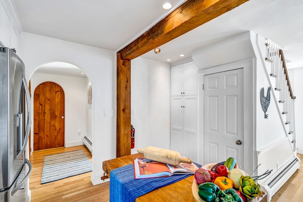 396 Plainfield Road, Unit 396 Concord, MA 01742 - Photo 12 of 24 a bedroom with a bed and a chandelier