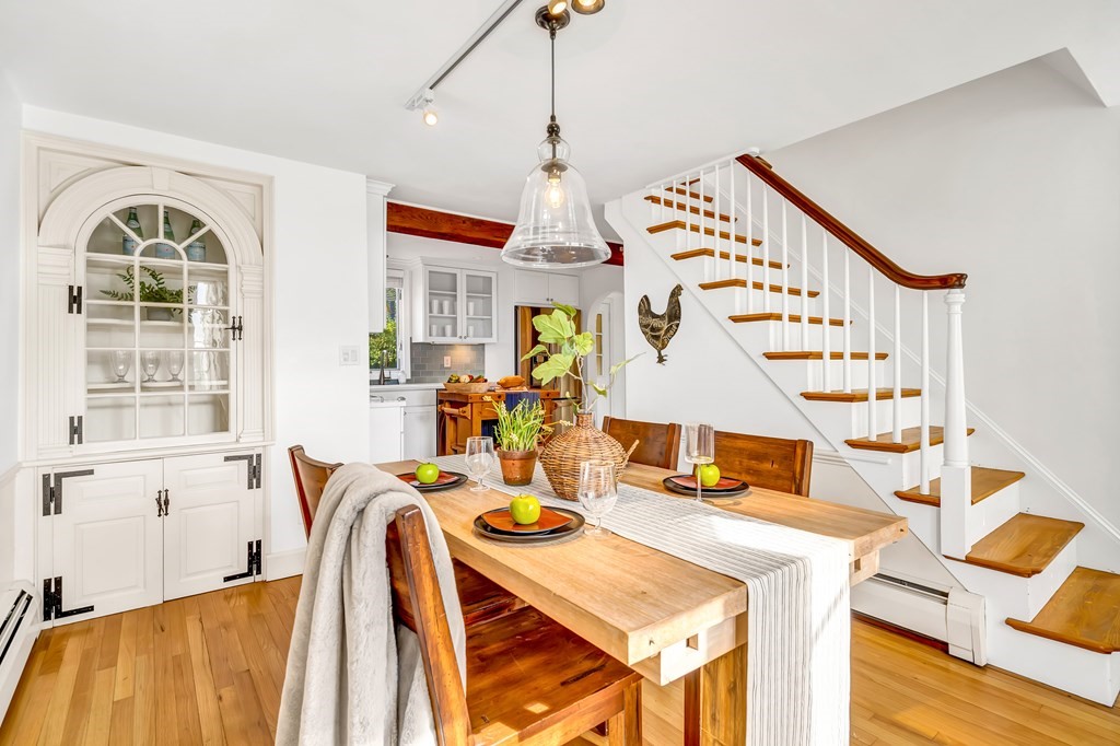 396 Plainfield Road, Unit 396 Concord, MA 01742 - Photo 14 of 24 a view of a dining room with furniture window and wooden floor
