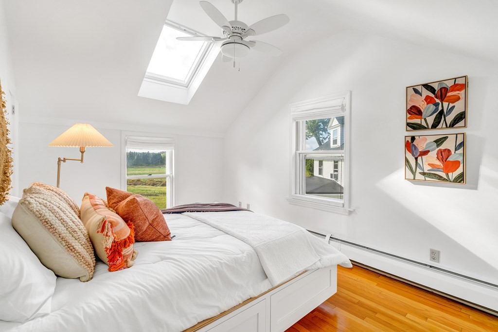 396 Plainfield Road, Unit 396 Concord, MA 01742 - Photo 16 of 24 a bedroom with a bed and a painting on the wall