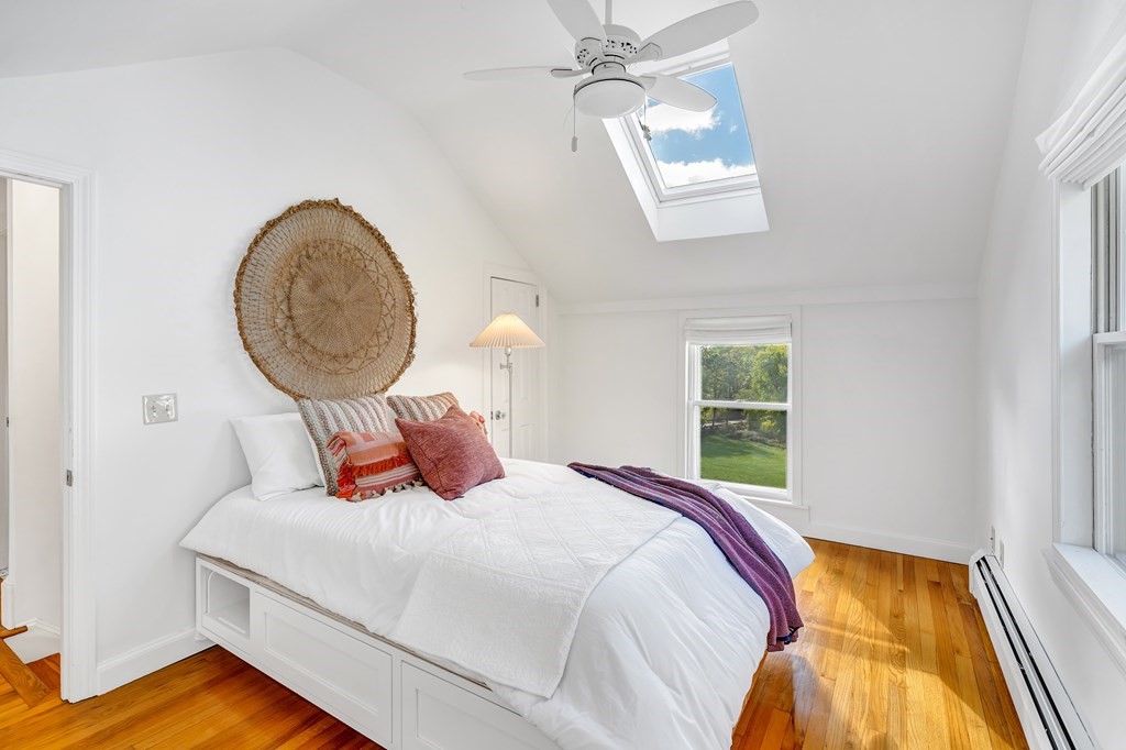 396 Plainfield Road, Unit 396 Concord, MA 01742 - Photo 17 of 24 a bedroom with a bed and a window